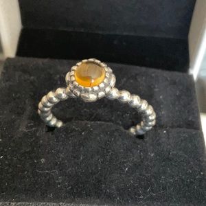 Pandora ring with amber colour stone